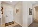 Bright foyer featuring tiled flooring, neutral walls, and an inviting entrance to the home at 16412 W Peppertree Ct, Surprise, AZ 85387