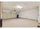 Spacious two-car garage with epoxy floor coating and ample room for storage or projects at 16412 W Peppertree Ct, Surprise, AZ 85387