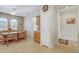 Functional kitchen with wood cabinets, breakfast table, and access to a doorway, offering convenience and charm at 16412 W Peppertree Ct, Surprise, AZ 85387