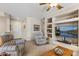 Comfortable living room with a built-in entertainment center and neutral color scheme, creating a welcoming atmosphere at 16412 W Peppertree Ct, Surprise, AZ 85387