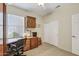Bedroom featuring a desk, cabinets and shelving to maximize space and convenience for any user at 16412 W Peppertree Ct, Surprise, AZ 85387