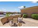 Inviting front patio with comfortable seating, plants, and desert landscaping at 16412 W Peppertree Ct, Surprise, AZ 85387