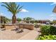 Inviting front patio with comfortable seating, plants, and desert landscaping at 16412 W Peppertree Ct, Surprise, AZ 85387