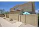 Charming home exterior featuring a neutral color scheme, private courtyard, and partial shade from mature trees at 17032 N 16Th Dr # 8, Phoenix, AZ 85023