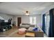 Bright living room with comfortable seating, ceiling fan, and easy access to the staircase at 17032 N 16Th Dr # 8, Phoenix, AZ 85023