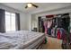 Bedroom with ceiling fan, closet, neutral carpet, and large window for ample natural light at 17032 N 16Th Dr # 8, Phoenix, AZ 85023