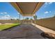 Spacious backyard with a covered patio, block wall and gate leading to the alley at 19031 N 13Th Dr, Phoenix, AZ 85027