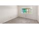 Cozy bedroom with carpet flooring, white walls, natural light from the window at 19031 N 13Th Dr, Phoenix, AZ 85027