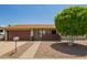Charming single-story home with a well-manicured xeriscaped yard and inviting front porch at 19031 N 13Th Dr, Phoenix, AZ 85027