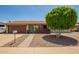 Charming single-story home with a well-manicured xeriscaped yard and inviting front porch at 19031 N 13Th Dr, Phoenix, AZ 85027