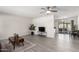 Bright living room with contemporary flooring, neutral paint, and view to the patio at 19031 N 13Th Dr, Phoenix, AZ 85027