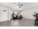 Inviting living room featuring tile flooring, neutral walls, and plenty of natural light at 19031 N 13Th Dr, Phoenix, AZ 85027