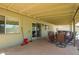 Covered patio area with outdoor seating and access to the backyard at 19031 N 13Th Dr, Phoenix, AZ 85027