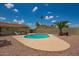 Sparkling backyard pool surrounded by desert landscaping and sunny skies at 19031 N 13Th Dr, Phoenix, AZ 85027