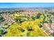 Aerial view of a community with golf course, lakes, tree lined streets, and well-maintained landscapes at 1955 Leisure World --, Mesa, AZ 85206
