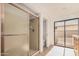 This bathroom features a light brown shower, a toilet, and a sliding glass door at 1955 Leisure World --, Mesa, AZ 85206