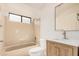 This small bathroom features a shower and bathtub combo with a single sink and vanity at 1955 Leisure World --, Mesa, AZ 85206