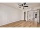 An empty bedroom with wood floors, a ceiling fan, and a walk in closet at 1955 Leisure World --, Mesa, AZ 85206
