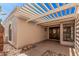 Covered entryway with stylish double doors and desert landscaping that provides a welcoming curb appeal at 1955 Leisure World --, Mesa, AZ 85206