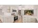 Spacious, modern kitchen with stainless steel appliances, new cabinets with gold hardware, and wood-look floors at 1955 Leisure World --, Mesa, AZ 85206