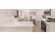 Bright kitchen featuring stainless steel appliances and white countertops and cabinets at 1955 Leisure World --, Mesa, AZ 85206
