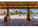 Inviting community pool area with lounge chairs and umbrellas, perfect for relaxing on a sunny day at 1955 Leisure World --, Mesa, AZ 85206