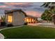 Inviting backyard featuring a well-maintained lawn, a covered patio, and a sparkling swimming pool perfect for relaxation and entertainment at 1963 E Monterey St, Chandler, AZ 85225