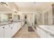 Spacious primary bathroom with dual vanities, soaking tub, and glass-enclosed shower at 1963 E Monterey St, Chandler, AZ 85225