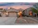Charming single-story home with a desert-landscaped front yard and a spacious three-car garage at 1963 E Monterey St, Chandler, AZ 85225