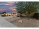Landscaped front yard with a tree, rocks and desert accents at 1963 E Monterey St, Chandler, AZ 85225