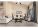 Comfortable living room with vaulted ceilings, soft sofas, and a glass door to the backyard at 1963 E Monterey St, Chandler, AZ 85225