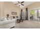 Bright living room with vaulted ceiling, comfortable sofas, and sliding glass door to patio at 1963 E Monterey St, Chandler, AZ 85225