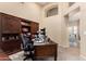 A dedicated home office space with custom built-in shelving and an executive desk ideal for remote work or study at 1963 E Monterey St, Chandler, AZ 85225