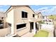The backyard features a small patio and faux grass at 215 W Mountain Sage Dr, Phoenix, AZ 85045