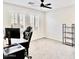 Bedroom featuring a workspace and shelving under a ceiling fan, plus natural light at 215 W Mountain Sage Dr, Phoenix, AZ 85045