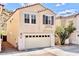 Inviting two-story home with a two-car garage and desert landscaping at 215 W Mountain Sage Dr, Phoenix, AZ 85045