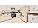 Modern kitchen featuring stainless steel appliances, granite counters, and white cabinets at 215 W Mountain Sage Dr, Phoenix, AZ 85045