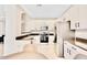 Modern kitchen featuring stainless steel appliances, ample counter space and white cabinetry at 215 W Mountain Sage Dr, Phoenix, AZ 85045
