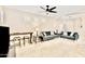 Open-concept living area with neutral tones and modern ceiling fan at 215 W Mountain Sage Dr, Phoenix, AZ 85045