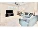 Bright and airy living room with tile floors and plenty of seating at 215 W Mountain Sage Dr, Phoenix, AZ 85045