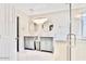 The main bathroom offers dual sinks, stylish lighting, and a glass shower at 215 W Mountain Sage Dr, Phoenix, AZ 85045