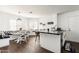 Bright kitchen with dark countertop island, breakfast nook, and hardwood floors; perfect for cooking and casual dining at 222 E Danbury Rd, Phoenix, AZ 85022