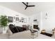 Bright living room showcases a modern fireplace, shiplap walls, and ample seating, ideal for entertaining and relaxing at 222 E Danbury Rd, Phoenix, AZ 85022