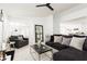 Open concept living room with modern furnishings, sleek decor, and abundant natural light, offering a welcoming space at 222 E Danbury Rd, Phoenix, AZ 85022