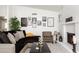 Stylish living room featuring shiplap accents, a cozy fireplace, and modern decor, creating an inviting and comfortable space at 222 E Danbury Rd, Phoenix, AZ 85022