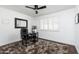 Office featuring a window and ceiling fan, as well as a desk with rolling chair at 222 E Danbury Rd, Phoenix, AZ 85022
