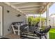 Inviting covered patio with comfortable seating, stylish decor, and string lights for a cozy ambiance at 222 E Danbury Rd, Phoenix, AZ 85022
