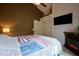 Inviting bedroom with a decorative fireplace, neutral tones, and a comfortable bed at 22364 N 59Th Ln, Glendale, AZ 85310
