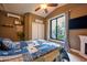 Tranquil bedroom featuring a ceiling fan, and a serene view of the outdoors at 22364 N 59Th Ln, Glendale, AZ 85310