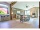 Open dining area with modern decor, bathed in natural light from large windows at 22364 N 59Th Ln, Glendale, AZ 85310